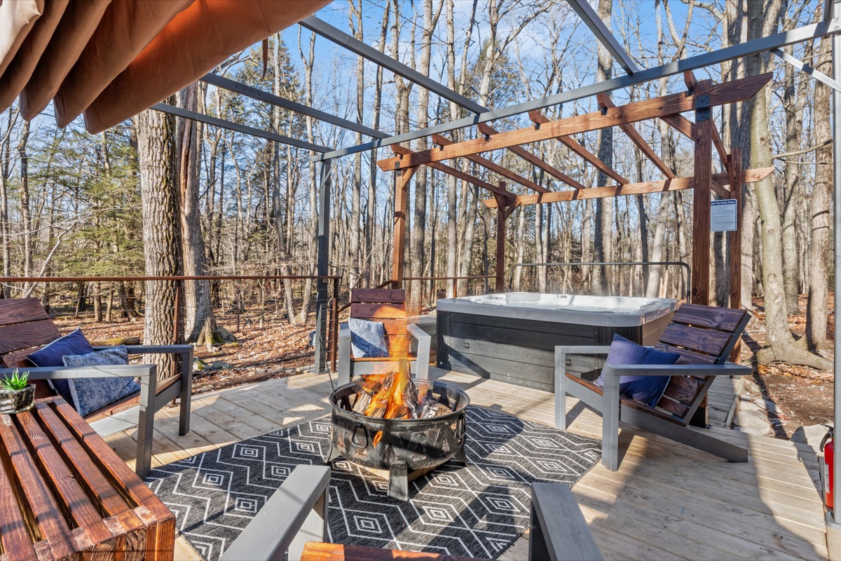 Private hot tub—perfect for relaxing under the stars in a peaceful forest setting.