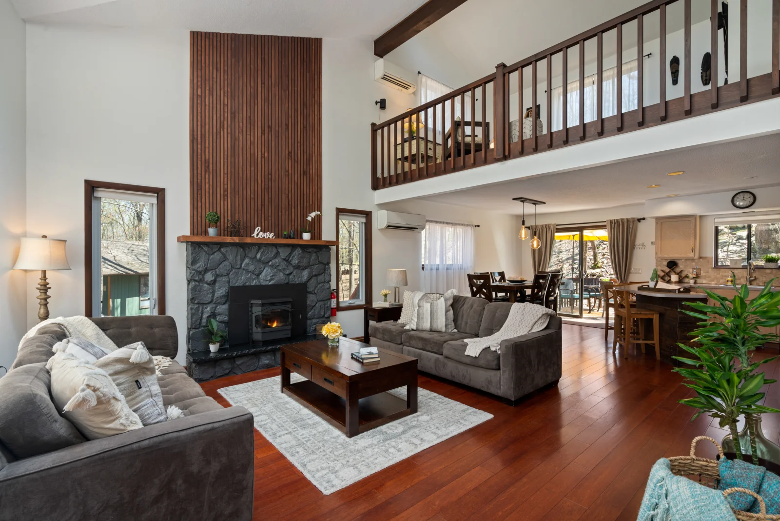 Bright living room with natural light and cozy seating.