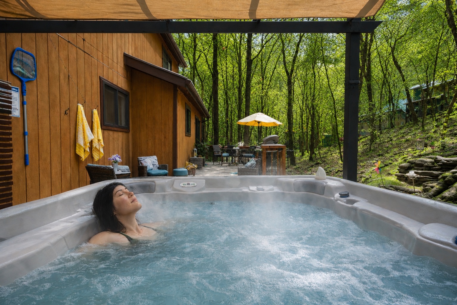7-person hot tub surrounded by trees — perfect to unwind.