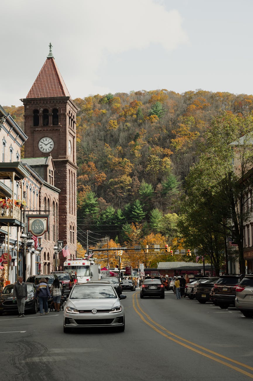 Scenic view of a street with a clock tower surrounded by autumn foliage in Jim Thorpe, PA.