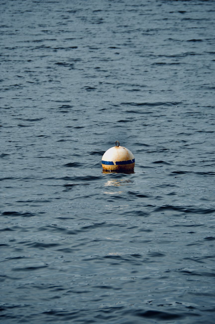 A solitary buoy floats on the calm waters of Pocono Pines, Pennsylvania.