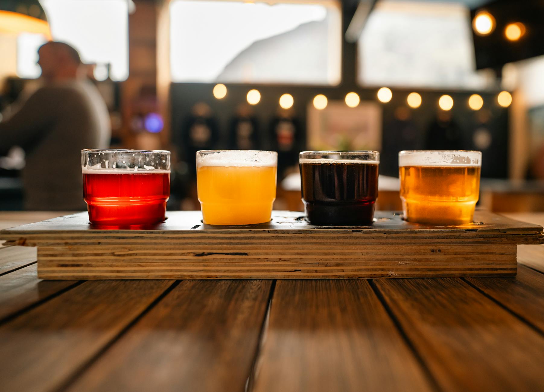 A selection of craft beers in a rustic pub, showcasing variety and ambiance.