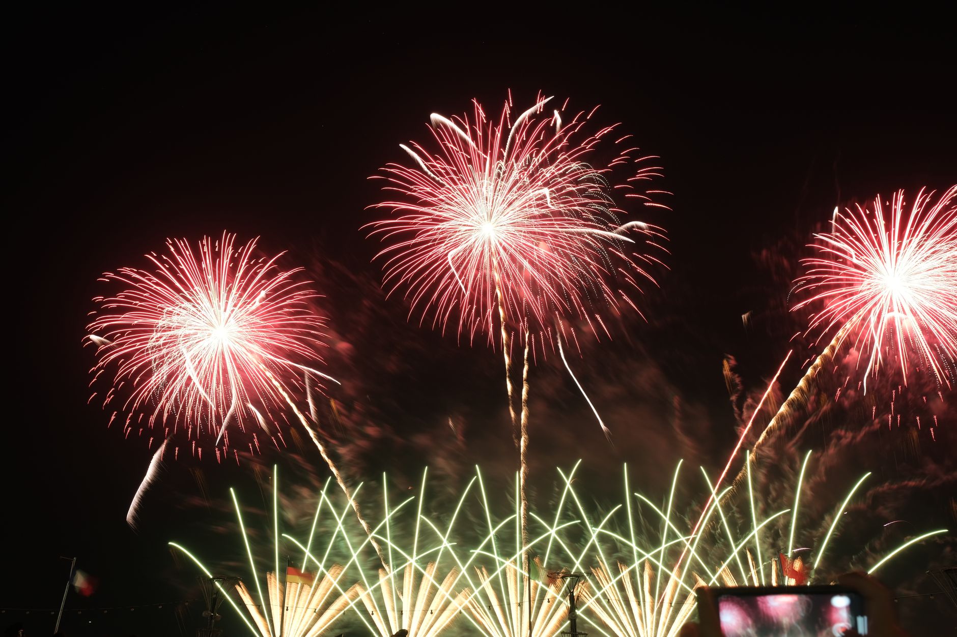 A vivid display of colorful fireworks lighting up the night sky during a celebration.